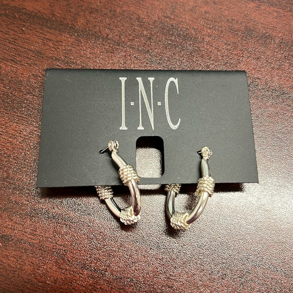 INC cute silver tone oval hoops. Nice rope detail.